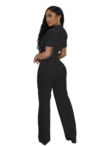 Vue arrière de la combinaison noire à manches courtes, jambes larges et taille haute