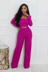 Detail of elegant rose red wide-leg jumpsuit with cutout neckline and gold chain belt