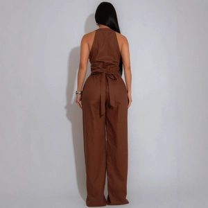 Deep brown sleeveless halter neck jumpsuit with tie-waist belt and wide-leg trousers