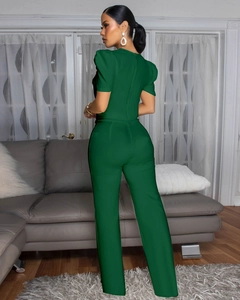 Detail of dark green short bubble sleeve jumpsuit with elegant straight leg fit