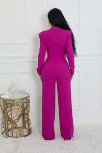 Detail view of back zipper closure on rose red long sleeve wide leg jumpsuit for women