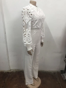 Detailed side view of white lace long sleeve top and high waist wide leg pants set