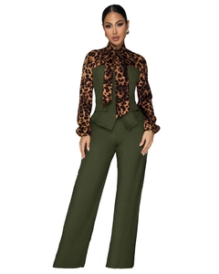 Detail of leopard print sleeves and large bow tie neckline on olive green jumpsuit