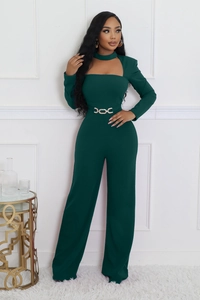 Detail of dark green wide-leg jumpsuit with cutout neckline and gold chain waist belt