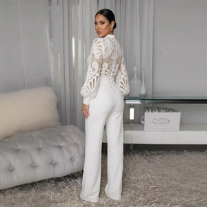 Elegant white long sleeve jumpsuit featuring lace bodice and high waist wide leg pants