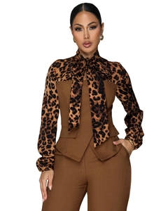 Detail of elegant leopard print blouse with bow tie and brown tailored vest set