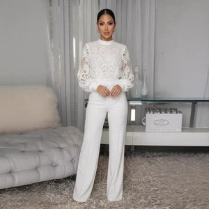 Elegant white two-piece set featuring a floral lace long sleeve top and wide-leg trousers