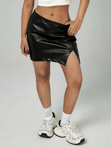 Black PU leather mini skirt with irregular waist and side slit shown on model