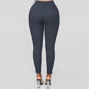 Rear view of high waist dark grey skinny trousers with functional back pockets