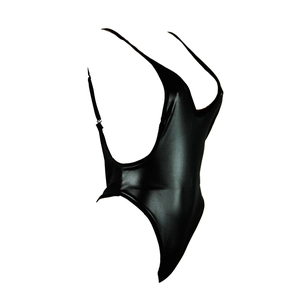 Macro detail of sexy black faux leather one-piece bodysuit with high-gloss finish