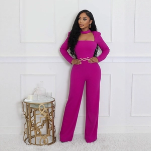 Elegant fuchsia wide-leg jumpsuit with long sleeves, choker cut-out, and gold chain waist