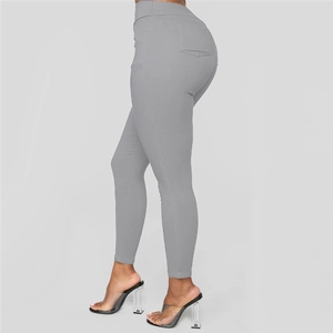 Close-up of high-waisted grey skinny pants showing back pocket and slim fit details