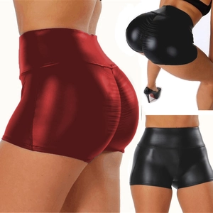 Macro detail of high waist scrunch butt lifting faux leather shorts in black and red wine