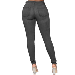 Macro detail of high-waist dark grey skinny jeans back view showing pockets and fabric texture