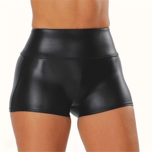 Close-up of black high-waisted faux leather shorts with shiny texture and slim fit