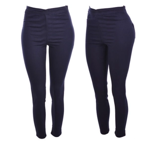 Detail view of high waist dark blue skinny pants showing stretch and slimming silhouette