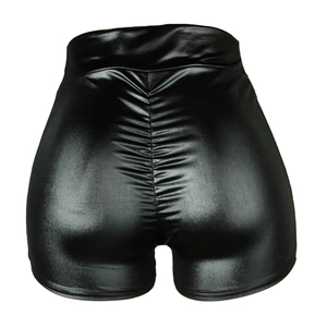 Detail view of black faux leather scrunch butt shorts with metallic shiny finish