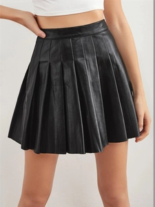 Front view of black high waist pleated PU leather mini skirt on model with smooth texture