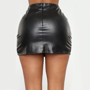 Macro shot of the black faux leather texture and zipper closure on a tight mini skirt