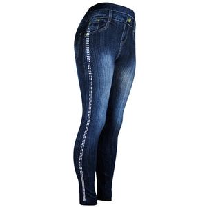 Detail view of high-waist denim print leggings with white side polka dot patterns