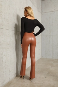 Rear view of high waist stretch PU leather flared trousers with split hem detail