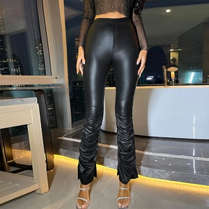 Women's black high-waisted faux leather leggings with gathered pleated hem and chic side slits