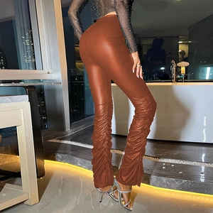 Detail of caramel high waist ruched faux leather pants with stylish stacked leg design