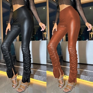 High-waisted PU leather skinny leggings with stacked ankles and side slits in black and brown