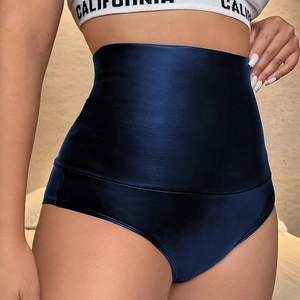 Close-up of high-waisted dark blue satin faux leather shorts with glossy finish