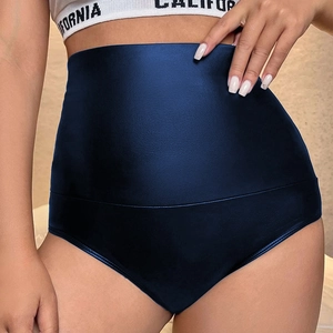 Detail view of high-waist tummy control dark blue shorts with elastic compression fit