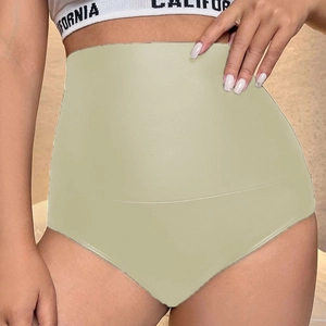 Detailed view of high-waisted seamless shaping shorts in beige for abdominal control