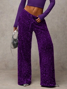 Detail of purple sequin wide-leg pants with adjustable drawstring waist and shiny texture