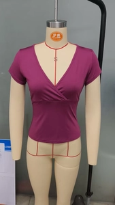 Detail of slim-fit purple deep V-neck wrap t-shirt showing elastic fabric and draping