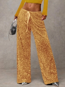 Detail of sequined wide leg pants with adjustable drawstring waist for fashion styling