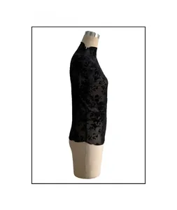 Side view of black mesh top showing burnout floral patterns and stand collar