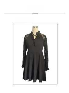Detail view of black A-line dress featuring lace sleeves and cutout tie neckline on mannequin