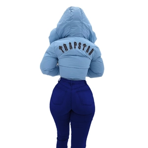 Slim fit high-waisted denim jeans paired with a light blue hooded Trapstar puffer jacket