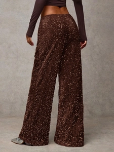 Close-up of sparkling dark brown sequin wide leg pants showing texture and shine