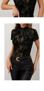 Detail of black floral lace top with stand collar and delicate ruffle trim on sleeves