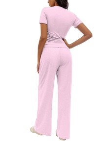 Rear side view of pink pleated short sleeve top and wide leg pants loungewear set