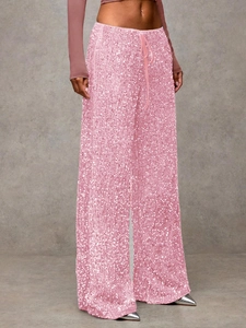 Detail of pink sequin wide-leg pants with high waist drawstring and shiny fabric