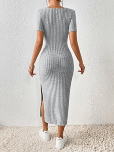Detailed back view of a slim-fit grey ribbed knit dress with elegant side slit detail
