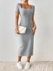 Detail shot of the vertical rib-knit texture and slim fit design of a grey midi dress
