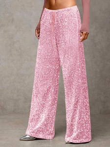 Detail of pink sequins and drawstring waist on elegant wide leg fashion pants for women