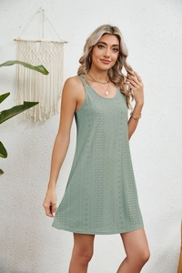 Detailed texture of sage green A-line dress featuring eyelet embroidery and double straps