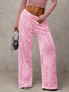 Close-up of pink sequin wide leg pants featuring drawstring waist and sparkling texture