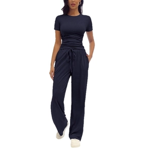 Women's navy blue two-piece lounge set with short sleeve pleated top and wide leg pants