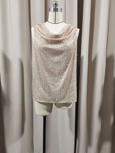 Macro detail of champagne sequined tank top with elegant draped cowl neck and sleeveless design