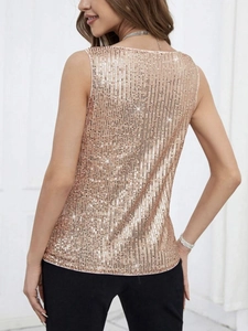 Close-up of rose gold sequins on a sleeveless V-neck vest showing high reflective texture