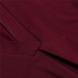 Close-up of wine red V-neckline stitching and premium textured fabric on women shirt